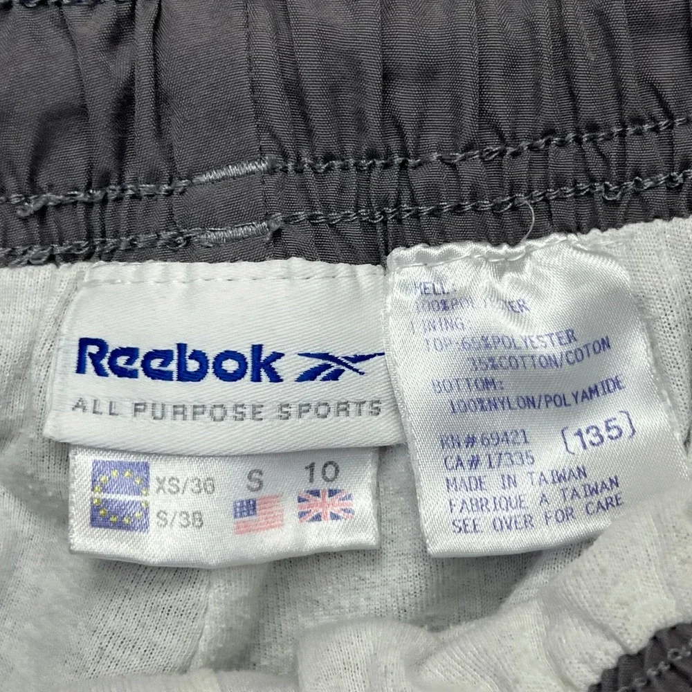 VINTAGE 90s Reebok Track Pants Womens Small Grey Faded Tapered Lined Ankle Zip